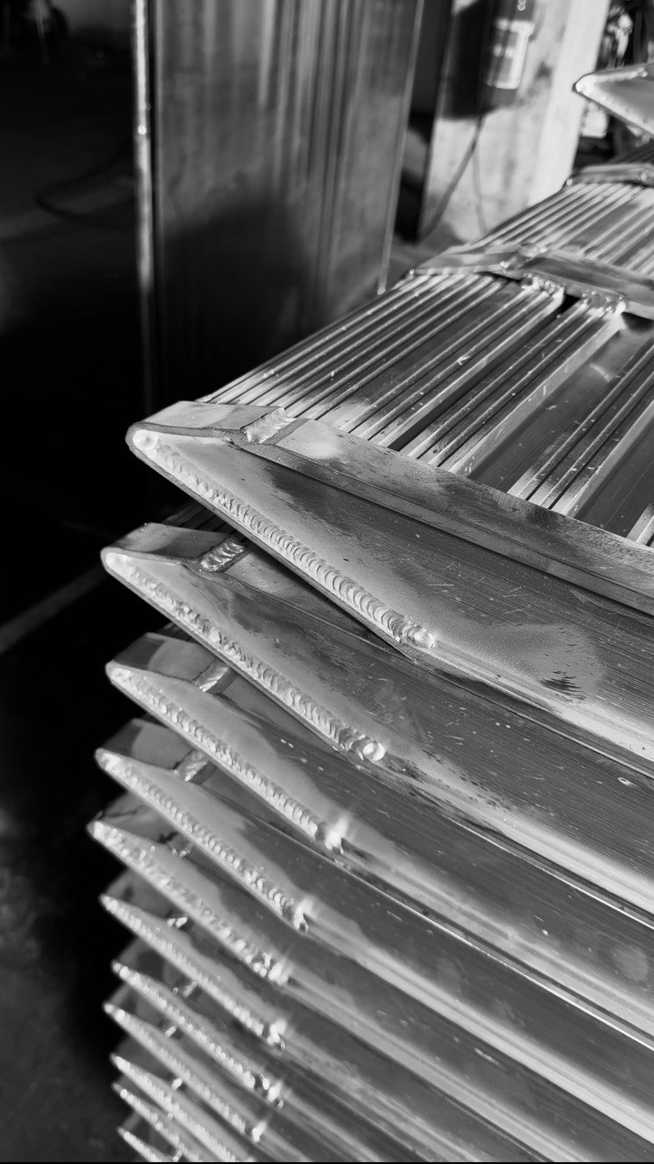 A series of welded aluminium components